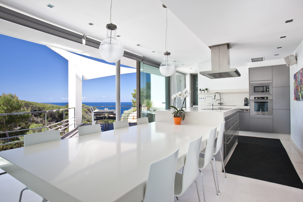 Kitchen and the dining table with views of outside the house
